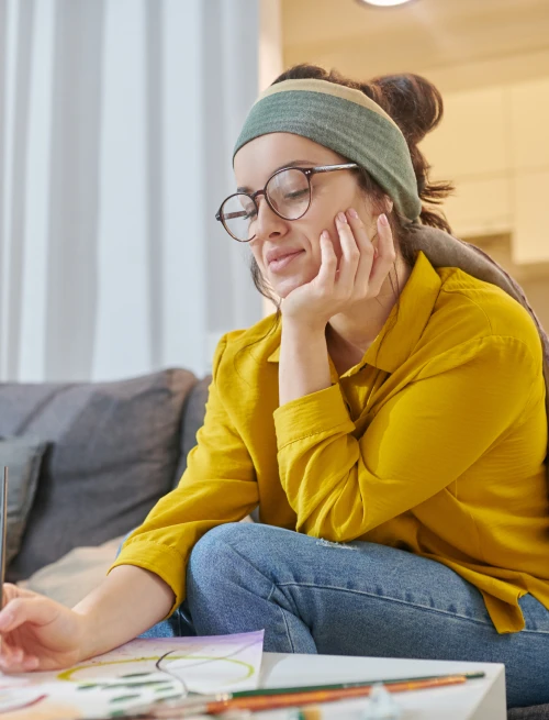 Female artist sitting studio with new sketches